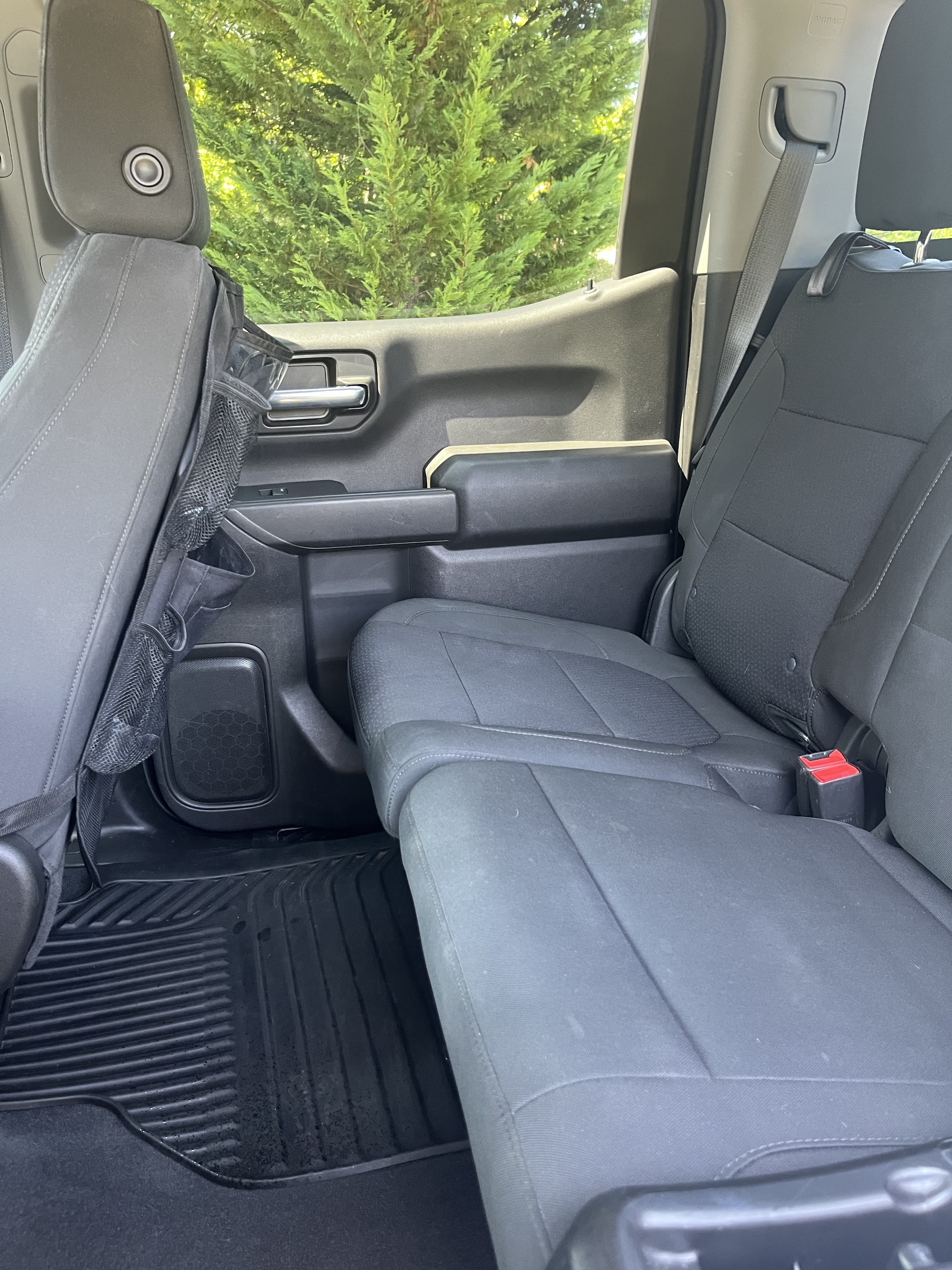 The rear seat and floor mats of a pickup after an interior clean
